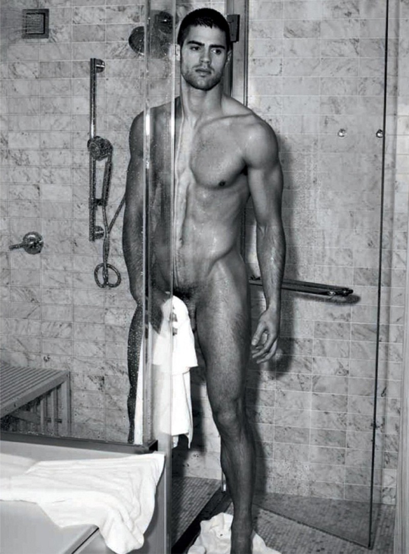 The man washes in the shower naked