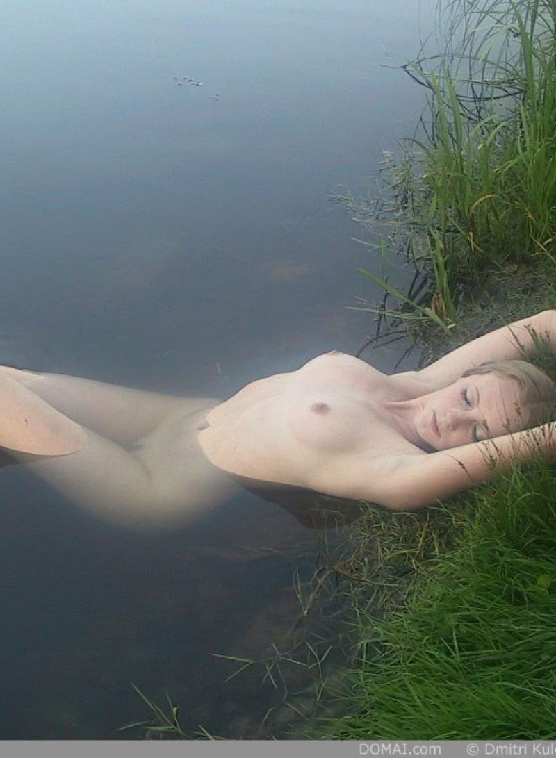 Naked on a village pond