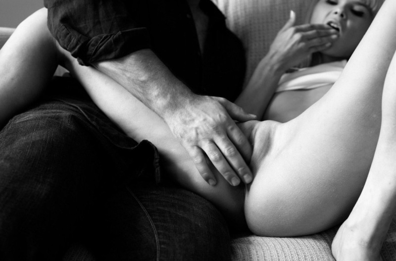 The guy caresses the clitoris with his fingers