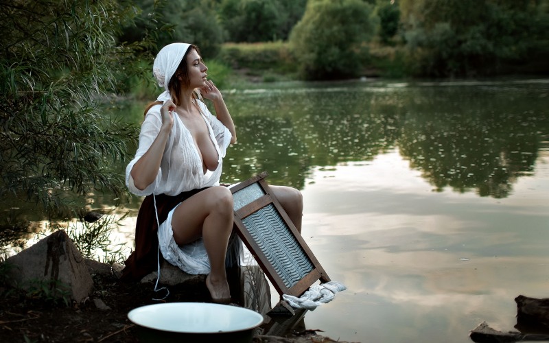 Washing on the river naked