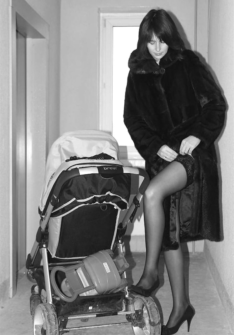 Mom with a stroller on a bench