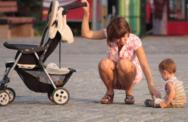 Naked mothers without panties with a stroller