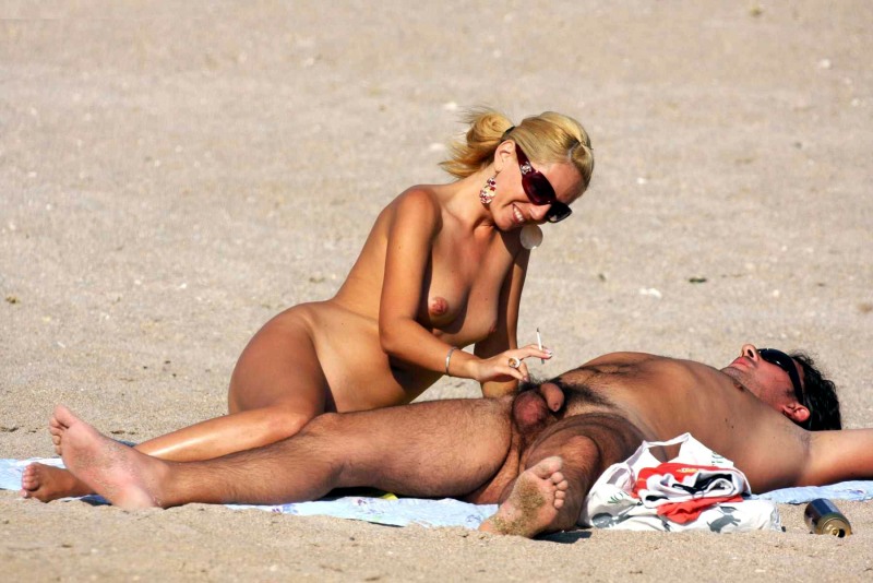 Naked men and women on the beach