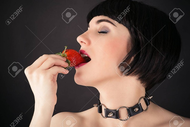 Girls with vegetables in the mouth