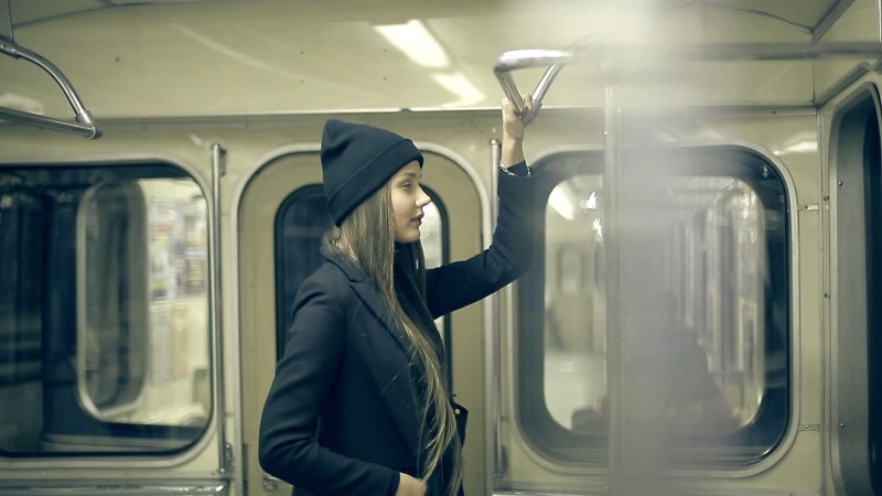 Girl rides in the subway in the hood