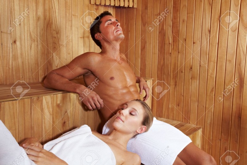 A guy in a sauna with chicks