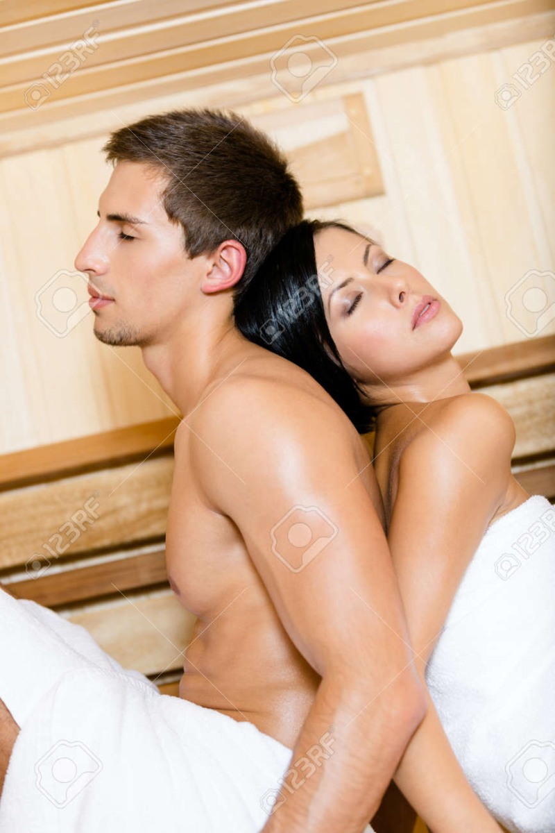Two girls and a guy in a sauna