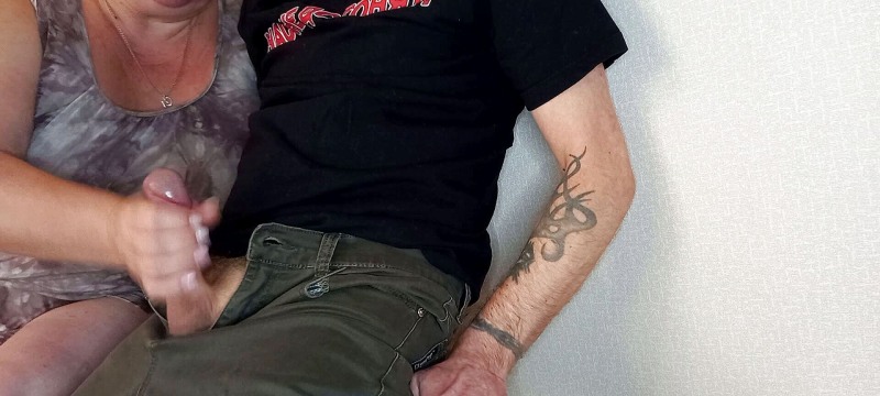 A man shows a member to passers -by