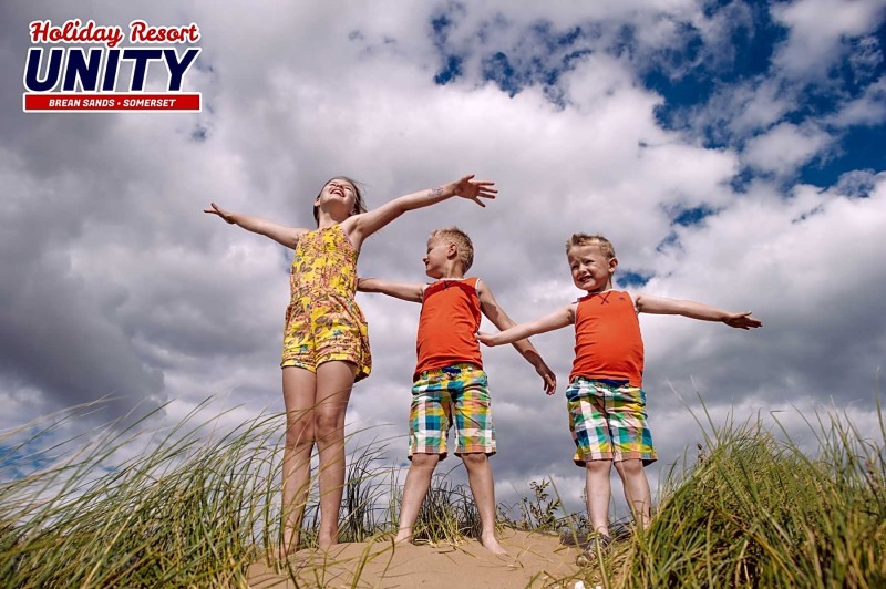 Family on the beach girls 10 years old