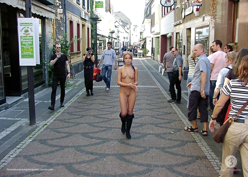 The naked along the street was walking