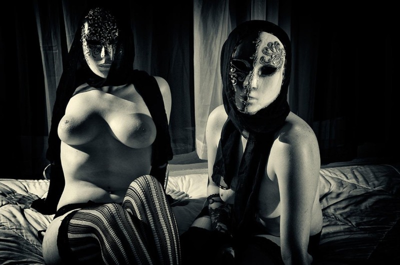 Naked women in masquerade masks