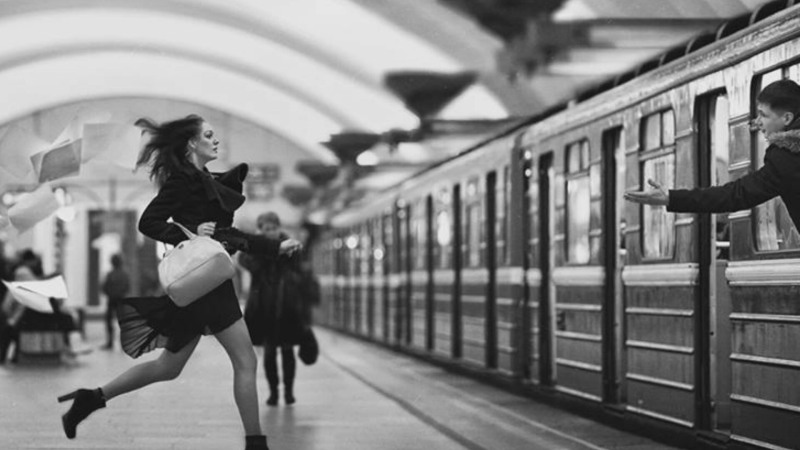 A person runs after a train