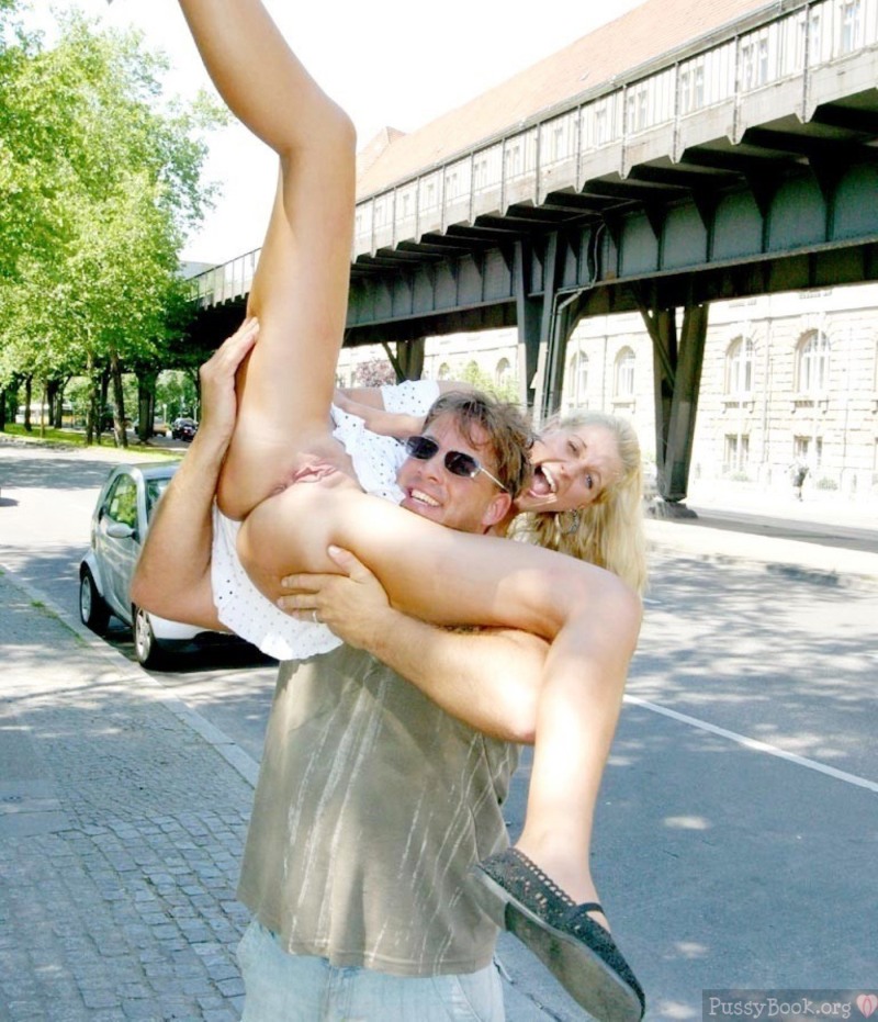 Girls spread their legs in public