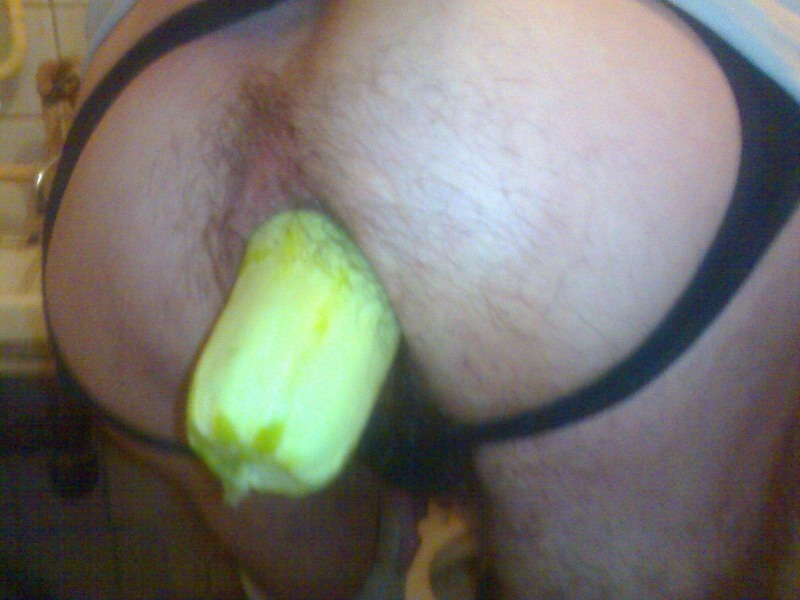 Huge cucumber in the pussy