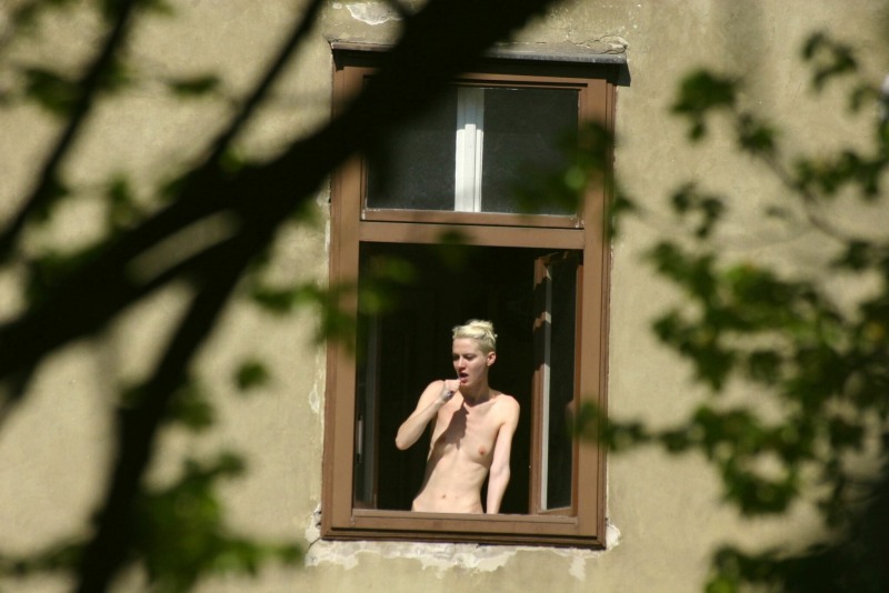 Naked on the balcony spied