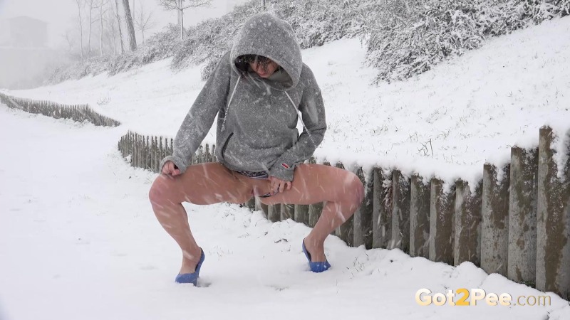 Naked girls remove snow