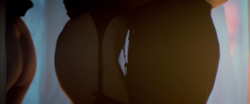 Naked brunette with collected hair