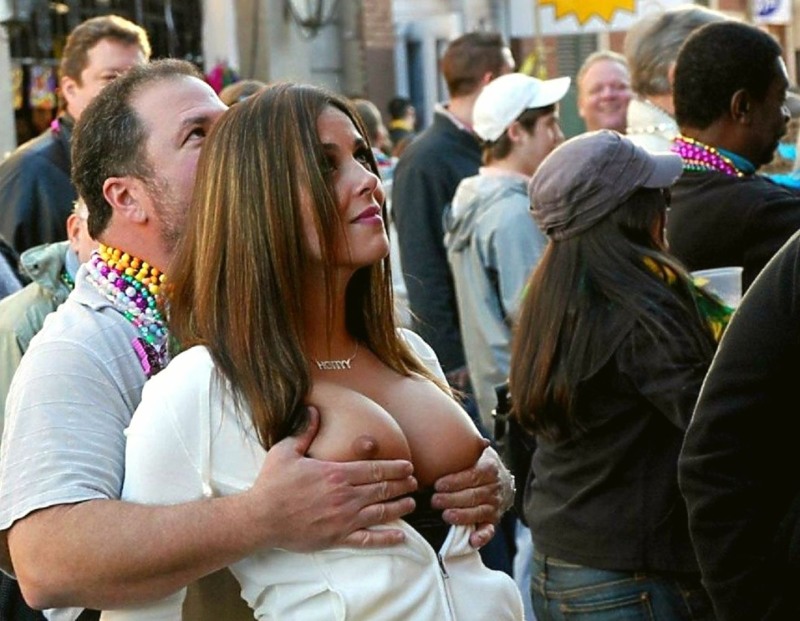The girl shows her breasts in public